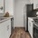 a kitchen with white cabinets