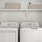 a white washing machine and a shelf