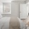 a bedroom with a fan