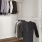 a closet with clothes