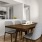 a kitchen with a table and chairs