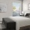 a bedroom with a bed and a bench