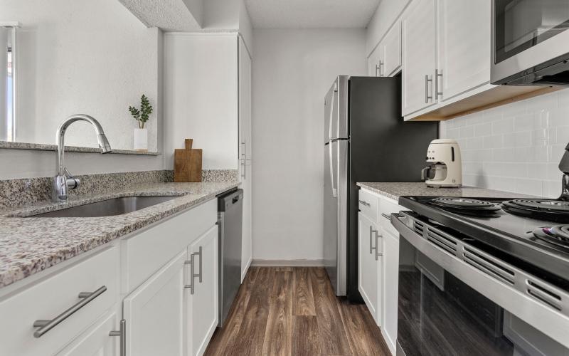 a kitchen with white cabinets