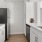 a kitchen with white cabinets